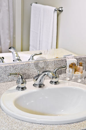 To use this stock image in your creative project, please select the size you need over to the right and click the "Add to Cart" button.
Your downloaded image will come with the Cutcaster watermark removed so don’t worry about the watermark you see on this page. Bathroom sink stock photo, Bathroom interior with white sink, faucet and mirror by Elena Elisseeva