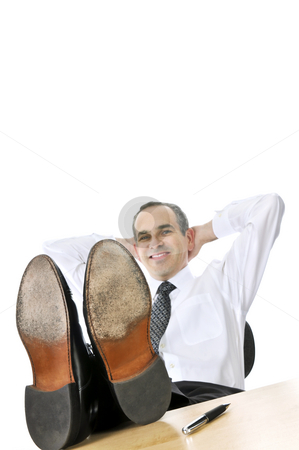 To use this stock image in your creative project, please select the size you need over to the right and click the "Add to Cart" button.
Your downloaded image will come with the Cutcaster watermark removed so don’t worry about the watermark you see on this page. Relaxing businessman stock photo, Relaxing businessman with feet up on his desk by Elena Elisseeva