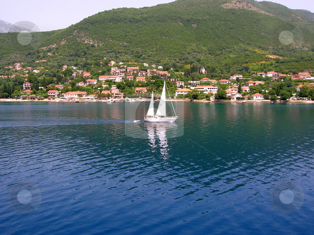 To use this stock image in your creative project, please select the size you need over to the right and click the "Add to Cart" button.
Your downloaded image will come with the Cutcaster watermark removed so don’t worry about the watermark you see on this page. Sailing boat over blue water stock photo, White sailing boat over blue adriatic sea in montenegro by Julija Sapic