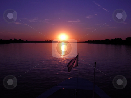 To use this stock image in your creative project, please select the size you need over to the right and click the "Add to Cart" button.
Your downloaded image will come with the Cutcaster watermark removed so don’t worry about the watermark you see on this page. Purple sunset stock photo, Purple sunset over dark river from boat by Julija Sapic