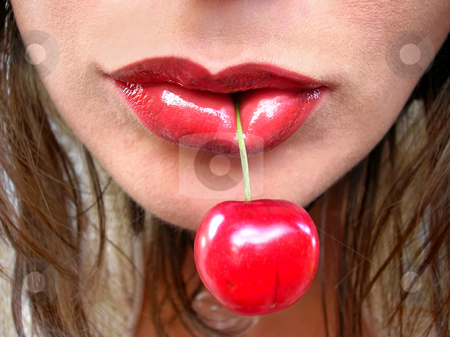 To use this stock image in your creative project, please select the size you need over to the right and click the "Add to Cart" button.
Your downloaded image will come with the Cutcaster watermark removed so don’t worry about the watermark you see on this page. Red cherry in red lips stock photo, Large red cherry in red female lips close up by Julija Sapic