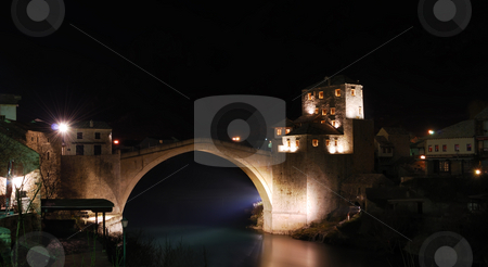 To use this stock image in your creative project, please select the size you need over to the right and click the "Add to Cart" button.
Your downloaded image will come with the Cutcaster watermark removed so don’t worry about the watermark you see on this page. Old Bridge in Mostar at Night stock photo, Old Bridge in Mostar at night reconstructed in 2003 after the original from 1556. by Denis Radovanovic