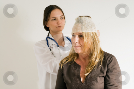 To use this stock image in your creative project, please select the size you need over to the right and click the "Add to Cart" button.
Your downloaded image will come with the Cutcaster watermark removed so don’t worry about the watermark you see on this page. Bandaging an Head - Horizontal, Isolated stock photo, Young female medical student bandaging a middle-aged woman's head. by Orange Line Media