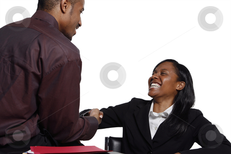 To use this stock image in your creative project, please select the size you need over to the right and click the "Add to Cart" button.
Your downloaded image will come with the Cutcaster watermark removed so don’t worry about the watermark you see on this page. Businesspeople Shaking Hands stock photo, Male and female business colleagues smiling broadly and shaking hands by Orange Line Media