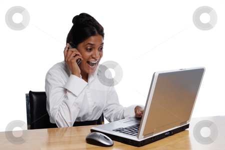 To use this stock image in your creative project, please select the size you need over to the right and click the "Add to Cart" button.
Your downloaded image will come with the Cutcaster watermark removed so don’t worry about the watermark you see on this page. Happy Businesswoman at Desk stock photo, Surprised, isolated, businesswoman at desk happily using a laptop and talking on cellphone. by Orange Line Media