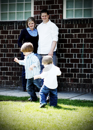 To use this stock image in your creative project, please select the size you need over to the right and click the "Add to Cart" button.
Your downloaded image will come with the Cutcaster watermark removed so don’t worry about the watermark you see on this page. Family Fun stock photo, Adorable family of four playing in the sunshine together. Vertical, high-contrast shot by Orange Line Media