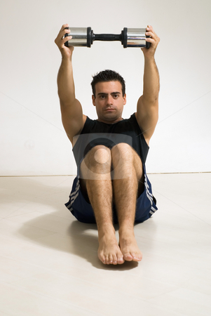 To use this stock image in your creative project, please select the size you need over to the right and click the "Add to Cart" button.
Your downloaded image will come with the Cutcaster watermark removed so don’t worry about the watermark you see on this page. Doing a Sit-up - Vertical, Isolated stock photo, Male weightlifter / athlete doing a sit-up with a dumbbell weight. by Orange Line Media