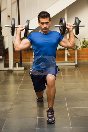 To use this stock image in your creative project, please select the size you need over to the right and click the "Add to Cart" button.
Your downloaded image will come with the Cutcaster watermark removed so don’t worry about the watermark you see on this page. Man Doing Lunges stock photo, Athletic, attractive man doing lunges with dumbbells in a gym by Orange Line Media