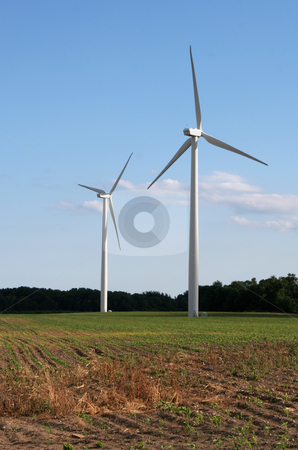 To use this stock image in your creative project, please select the size you need over to the right and click the "Add to Cart" button.
Your downloaded image will come with the Cutcaster watermark removed so don’t worry about the watermark you see on this page. Facing the Future stock photo, Two wind power generators in a field shot against a blue sky. by Chris Hill