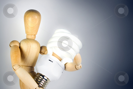 To use this stock image in your creative project, please select the size you need over to the right and click the "Add to Cart" button.
Your downloaded image will come with the Cutcaster watermark removed so don’t worry about the watermark you see on this page. Compact Fluorescent Bulb stock photo, A wooden model grasping a compact fluorescent light bulb. Great for energy savings or going green concepts. by Todd Arena