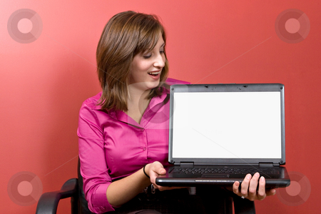 To use this stock image in your creative project, please select the size you need over to the right and click the "Add to Cart" button.
Your downloaded image will come with the Cutcaster watermark removed so don’t worry about the watermark you see on this page. Woman Showing Her Screen stock photo, Business woman with a laptop - clipping path for the screen area isolation is included. by Todd Arena