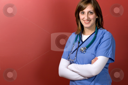 To use this stock image in your creative project, please select the size you need over to the right and click the "Add to Cart" button.
Your downloaded image will come with the Cutcaster watermark removed so don’t worry about the watermark you see on this page. Young Woman Doctor stock photo, A young woman doctor with her arms crossed isolated over a red background by Todd Arena