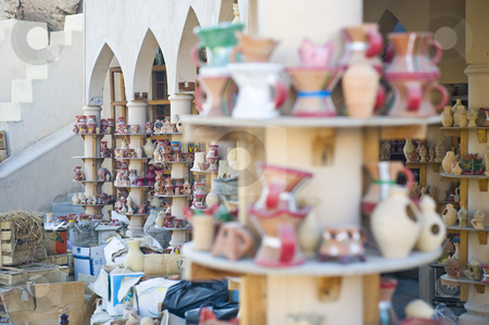 To use this stock image in your creative project, please select the size you need over to the right and click the "Add to Cart" button.
Your downloaded image will come with the Cutcaster watermark removed so don’t worry about the watermark you see on this page. Traditional Arabian market stock photo, Traditional Arabian market in Oman with various ceramic items on display, including incense burners and water pots. by Nicolaas Traut
