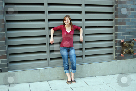 To use this stock image in your creative project, please select the size you need over to the right and click the "Add to Cart" button.
Your downloaded image will come with the Cutcaster watermark removed so don’t worry about the watermark you see on this page. Teen Standing in Front of Ventilation Opening stock photo, Outdoor shot of a smiling teenage girl standing in front of a building's ventilation openneing. by Orange Line Media