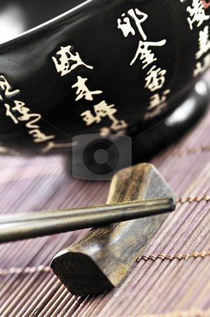 To use this stock image in your creative project, please select the size you need over to the right and click the "Add to Cart" button.
Your downloaded image will come with the Cutcaster watermark removed so don’t worry about the watermark you see on this page. Rice bowl and chopsticks stock photo, Asian rice bowl and wooden chopsticks on a rest close up by Elena Elisseeva