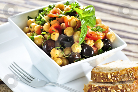To use this stock image in your creative project, please select the size you need over to the right and click the "Add to Cart" button.
Your downloaded image will come with the Cutcaster watermark removed so don’t worry about the watermark you see on this page. Vegetarian chickpea salad stock photo, Vegetarian meal of chickpea or garbanzo beans salad by Elena Elisseeva