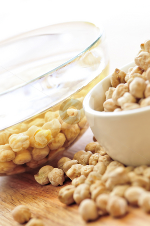 To use this stock image in your creative project, please select the size you need over to the right and click the "Add to Cart" button.
Your downloaded image will come with the Cutcaster watermark removed so don’t worry about the watermark you see on this page. Chickpeas stock photo, Chickpeas dried in a bowl and soaking in water by Elena Elisseeva