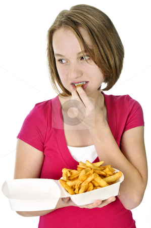 To use this stock image in your creative project, please select the size you need over to the right and click the "Add to Cart" button.
Your downloaded image will come with the Cutcaster watermark removed so don’t worry about the watermark you see on this page. Teenage girl with french fries stock photo, Teenage eating french fries isolated on white background by Elena Elisseeva