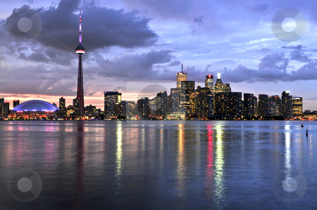 To use this stock image in your creative project, please select the size you need over to the right and click the "Add to Cart" button.
Your downloaded image will come with the Cutcaster watermark removed so don’t worry about the watermark you see on this page. Toronto skyline stock photo, Scenic view at Toronto city waterfront skyline at sunset by Elena Elisseeva