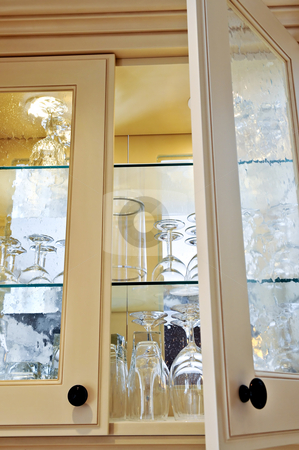 To use this stock image in your creative project, please select the size you need over to the right and click the "Add to Cart" button.
Your downloaded image will come with the Cutcaster watermark removed so don’t worry about the watermark you see on this page. Kitchen cabinet stock photo, Kitchen cabinet close up with glass shelves and glasses by Elena Elisseeva