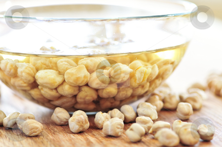 To use this stock image in your creative project, please select the size you need over to the right and click the "Add to Cart" button.
Your downloaded image will come with the Cutcaster watermark removed so don’t worry about the watermark you see on this page. Chickpeas stock photo, Dry raw chickpeas soaking in water before cooking by Elena Elisseeva