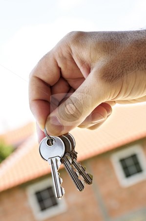 To use this stock image in your creative project, please select the size you need over to the right and click the "Add to Cart" button.
Your downloaded image will come with the Cutcaster watermark removed so don’t worry about the watermark you see on this page. Hand holding keys stock photo, Man's hand holding keys with a house under construction in background by Elena Elisseeva