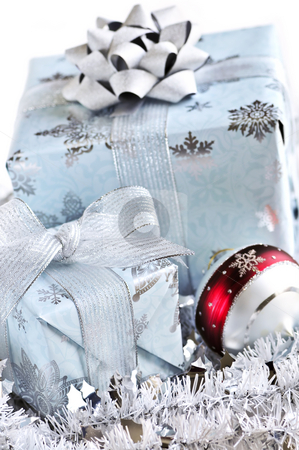 To use this stock image in your creative project, please select the size you need over to the right and click the "Add to Cart" button.
Your downloaded image will come with the Cutcaster watermark removed so don’t worry about the watermark you see on this page. Christmas gift boxes stock photo, Two gift boxes with Christmas ornaments on white background by Elena Elisseeva