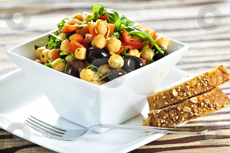 To use this stock image in your creative project, please select the size you need over to the right and click the "Add to Cart" button.
Your downloaded image will come with the Cutcaster watermark removed so don’t worry about the watermark you see on this page. Vegetarian chickpea salad stock photo, Vegetarian meal of chickpea or garbanzo beans salad by Elena Elisseeva