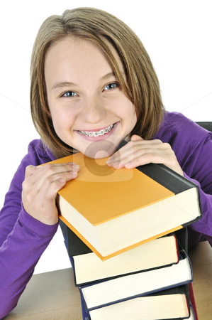 To use this stock image in your creative project, please select the size you need over to the right and click the "Add to Cart" button.
Your downloaded image will come with the Cutcaster watermark removed so don’t worry about the watermark you see on this page. Teenage girl studying stock photo, Happy teenage girl studying at the desk by Elena Elisseeva