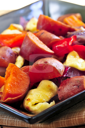 To use this stock image in your creative project, please select the size you need over to the right and click the "Add to Cart" button.
Your downloaded image will come with the Cutcaster watermark removed so don’t worry about the watermark you see on this page. Roasted sweet potatoes stock photo, Vegetarian dish of roasted yams with cheese and peppers by Elena Elisseeva