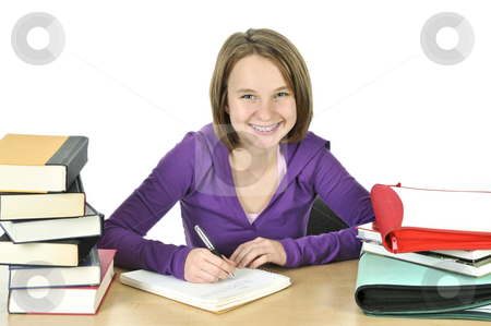 To use this stock image in your creative project, please select the size you need over to the right and click the "Add to Cart" button.
Your downloaded image will come with the Cutcaster watermark removed so don’t worry about the watermark you see on this page. Teenage girl studying stock photo, Happy teenage girl studying at the desk by Elena Elisseeva