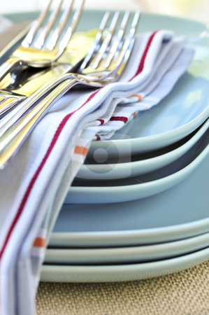To use this stock image in your creative project, please select the size you need over to the right and click the "Add to Cart" button.
Your downloaded image will come with the Cutcaster watermark removed so don’t worry about the watermark you see on this page. Plates and cutlery stock photo, Table setting with stack of plates and cutlery by Elena Elisseeva