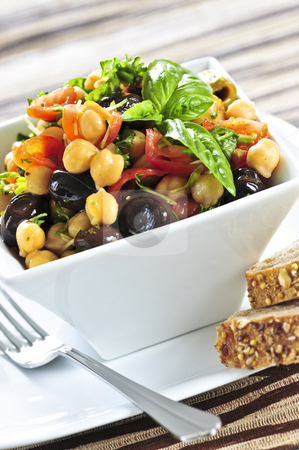 To use this stock image in your creative project, please select the size you need over to the right and click the "Add to Cart" button.
Your downloaded image will come with the Cutcaster watermark removed so don’t worry about the watermark you see on this page. Vegetarian chickpea salad stock photo, Vegetarian meal of chickpea or garbanzo beans salad by Elena Elisseeva