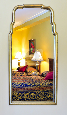 To use this stock image in your creative project, please select the size you need over to the right and click the "Add to Cart" button.
Your downloaded image will come with the Cutcaster watermark removed so don’t worry about the watermark you see on this page. Bedroom interior reflected in mirror stock photo, Bedroom interior reflected in mirror, image on the wall is my own. by Elena Elisseeva