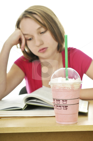 To use this stock image in your creative project, please select the size you need over to the right and click the "Add to Cart" button.
Your downloaded image will come with the Cutcaster watermark removed so don’t worry about the watermark you see on this page. Teenage girl with milkshake stock photo, Teenage school girl studying with a milkshake by Elena Elisseeva