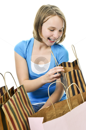 To use this stock image in your creative project, please select the size you need over to the right and click the "Add to Cart" button.
Your downloaded image will come with the Cutcaster watermark removed so don’t worry about the watermark you see on this page. Teenage girl with shopping bags stock photo, Happy teenage girl with lots of shopping bags by Elena Elisseeva