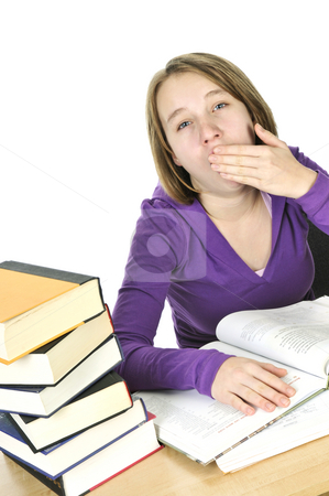 To use this stock image in your creative project, please select the size you need over to the right and click the "Add to Cart" button.
Your downloaded image will come with the Cutcaster watermark removed so don’t worry about the watermark you see on this page. Teenage girl studying stock photo, Yawning teenage girl studying at the desk by Elena Elisseeva
