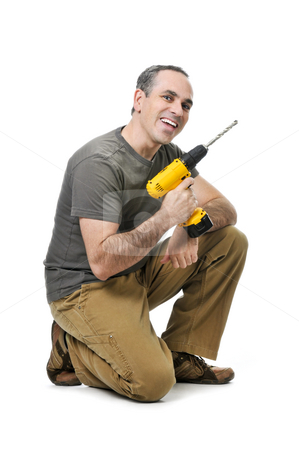 To use this stock image in your creative project, please select the size you need over to the right and click the "Add to Cart" button.
Your downloaded image will come with the Cutcaster watermark removed so don’t worry about the watermark you see on this page. Handyman with a drill stock photo, Kneeling happy handyman with his cordless drill by Elena Elisseeva