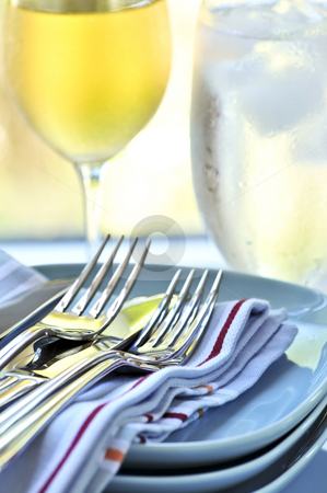 To use this stock image in your creative project, please select the size you need over to the right and click the "Add to Cart" button.
Your downloaded image will come with the Cutcaster watermark removed so don’t worry about the watermark you see on this page. Plates and cutlery stock photo, Table setting with stack of plates and cutlery by Elena Elisseeva
