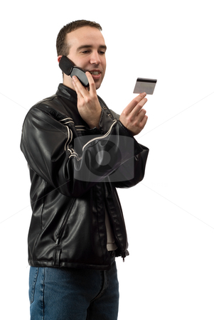To use this stock image in your creative project, please select the size you need over to the right and click the "Add to Cart" button.
Your downloaded image will come with the Cutcaster watermark removed so don’t worry about the watermark you see on this page. Telephone Banking stock photo, A young man doing some telephone banking and giving the bank his debit card number, isolated against a white background by Richard Nelson