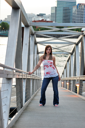 To use this stock image in your creative project, please select the size you need over to the right and click the "Add to Cart" button.
Your downloaded image will come with the Cutcaster watermark removed so don’t worry about the watermark you see on this page. Teen Standing on Gangway - Vertical stock photo, Vertically framed outdoor shot of a smiling teenage girl standing on gangway at a marina. by Orange Line Media