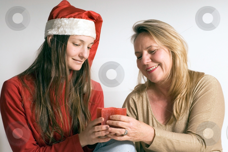 To use this stock image in your creative project, please select the size you need over to the right and click the "Add to Cart" button.
Your downloaded image will come with the Cutcaster watermark removed so don’t worry about the watermark you see on this page. Mother and Daughter stock photo, Mature woman and her daughter getting into the christmas spirit and holding a burning christmas candle. Both women are looking at the candle by Orange Line Media