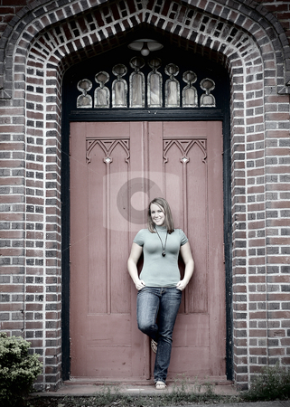To use this stock image in your creative project, please select the size you need over to the right and click the "Add to Cart" button.
Your downloaded image will come with the Cutcaster watermark removed so don’t worry about the watermark you see on this page. Young Adult Standing in front of Door - Cross Processed stock photo, Vertically framed black and white shot of an attractive young adult standing in front of a large door of a brick building. by Orange Line Media