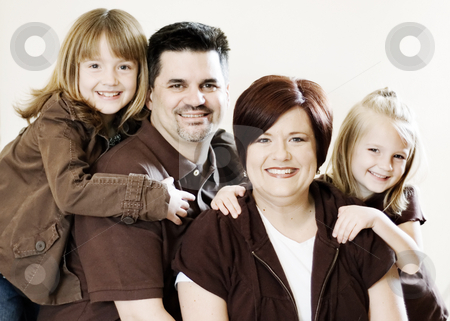 To use this stock image in your creative project, please select the size you need over to the right and click the "Add to Cart" button.
Your downloaded image will come with the Cutcaster watermark removed so don’t worry about the watermark you see on this page. Family Portrait stock photo, Family of four posing together in a studio. Horizontally framed shot against a clean studio background by Orange Line Media
