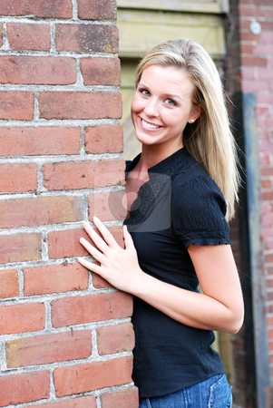 To use this stock image in your creative project, please select the size you need over to the right and click the "Add to Cart" button.
Your downloaded image will come with the Cutcaster watermark removed so don’t worry about the watermark you see on this page. Attractive Blond Woman stock photo, Attractive young blond woman casually dressed smiling at the camera while leaning against the brick wall of an abandoned building. Vertically framed shot. by Orange Line Media