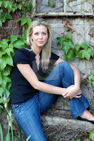 To use this stock image in your creative project, please select the size you need over to the right and click the "Add to Cart" button.
Your downloaded image will come with the Cutcaster watermark removed so don’t worry about the watermark you see on this page. Attractive Blond Woman stock photo, Attractive young blond woman casually dressed sitting by an ivy covered stone and brick wall by Orange Line Media