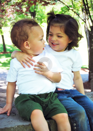 To use this stock image in your creative project, please select the size you need over to the right and click the "Add to Cart" button.
Your downloaded image will come with the Cutcaster watermark removed so don’t worry about the watermark you see on this page. Brother and Sister stock photo, Brother and sister sitting with their arms around each other on a sunny day in the park. by Orange Line Media