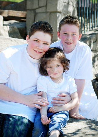 To use this stock image in your creative project, please select the size you need over to the right and click the "Add to Cart" button.
Your downloaded image will come with the Cutcaster watermark removed so don’t worry about the watermark you see on this page. Siblings stock photo, Two brothers and their sister sitting together in the park on a sunny day by Orange Line Media