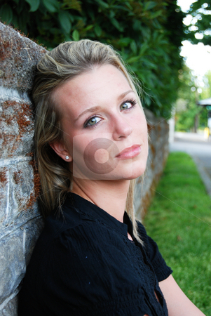 To use this stock image in your creative project, please select the size you need over to the right and click the "Add to Cart" button.
Your downloaded image will come with the Cutcaster watermark removed so don’t worry about the watermark you see on this page. Attractive Blond Woman stock photo, Close up of a young, attractive blond woman sitting against a brick wall on a summer day. Vertically framed shot by Orange Line Media