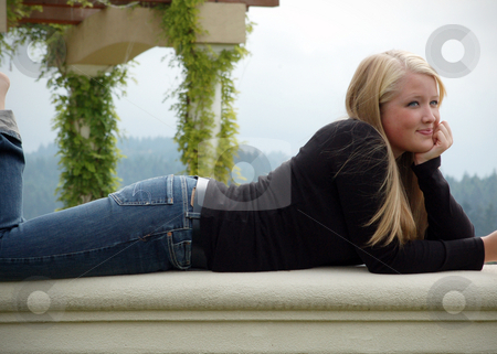 To use this stock image in your creative project, please select the size you need over to the right and click the "Add to Cart" button.
Your downloaded image will come with the Cutcaster watermark removed so don’t worry about the watermark you see on this page. Cute Blond Relaxing in the Sunshine stock photo, Cute blond woman relaxing in the sunshine relaxing on a stone wall with a blue sky in the background by Orange Line Media